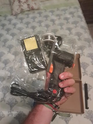Soldador de estaño con carrete.