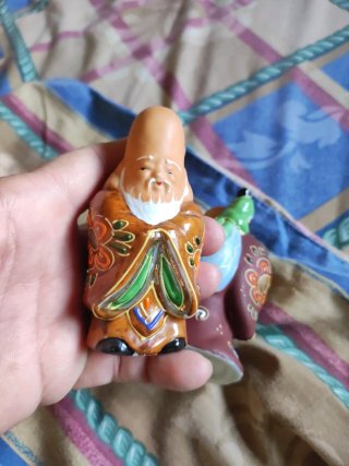 Figuras de la suerte de porcelana