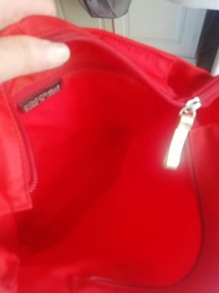 Borsa Coccinelle rossa con dettagli oro