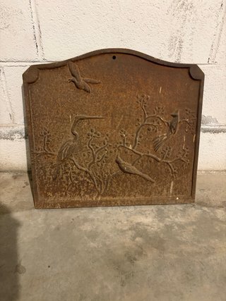 Placca decorativa in ghisa con uccelli