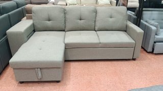 Sofá cama chaise longue gris con puff
