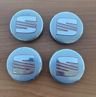 4 Tapabujes Seat 56mm originales plata nuevos