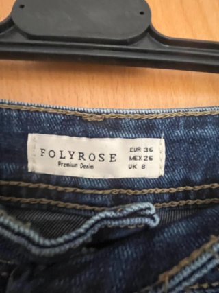 Pantalón vaquero ancho con trenza