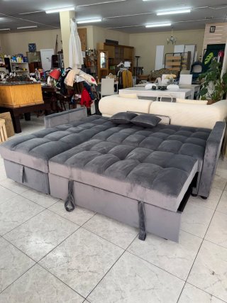 Sofá cama gris de tela