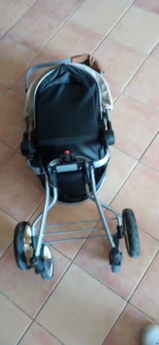 Cochecito de juguete para muñecas