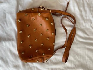 Bolso marrón mercules nuevo con estrellas doradas