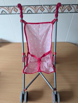 Silla de paseo para muñecas rosa