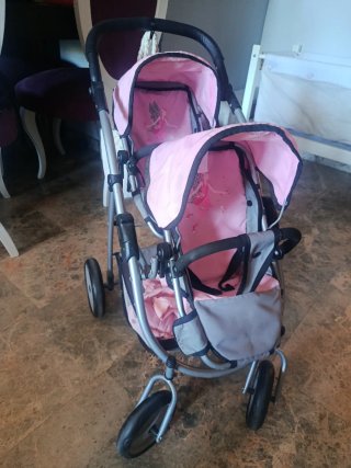 Carrito gemelar rosa con hadas