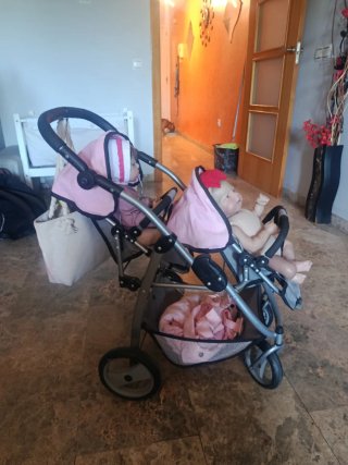 Carrito gemelar rosa con hadas