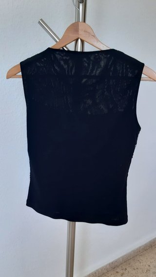 Top sin mangas. De lentejuelas. Nuevo. Color negro