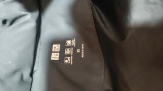 Chaqueta gris con capucha parka plumas Uniqlo