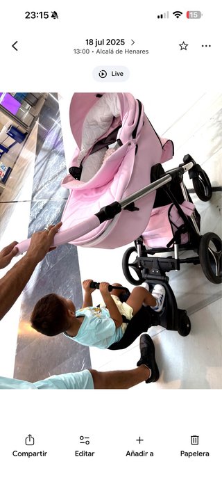 Carro de bebé rosa con bolso