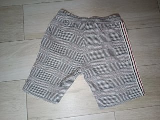 Pantalón corto a cuadros hombre