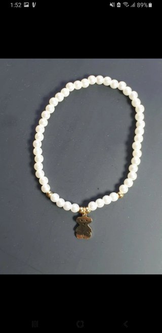 Pulsera elástica perlas y oso dorado