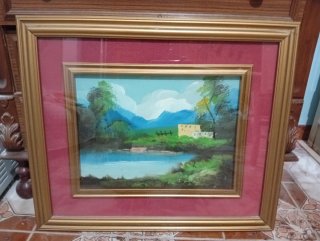Quadro con cornice dorata