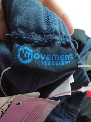 Pantalones deportivos unisex negros y naranjas