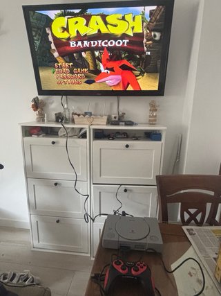 Pacchetto PS1 + Controller + Volante + Schede di Memoria + Giochi