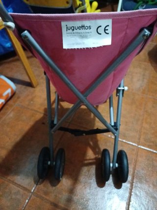Carrito de muñecas Juguettos rosa y blanco