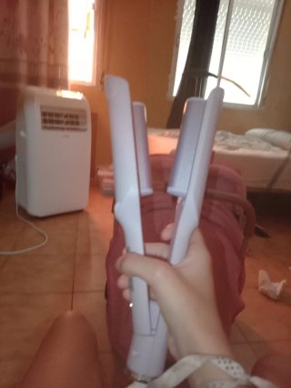 Rizador de pelo rosa y blanco