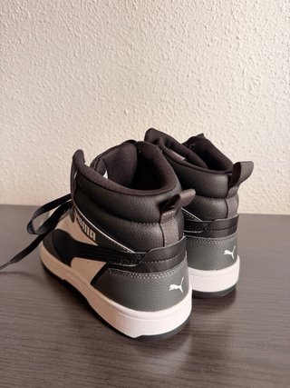 Zapatillas Puma altas negras y blancas