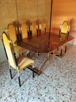 Mesa de centro cristal y metal con 6 sillas.