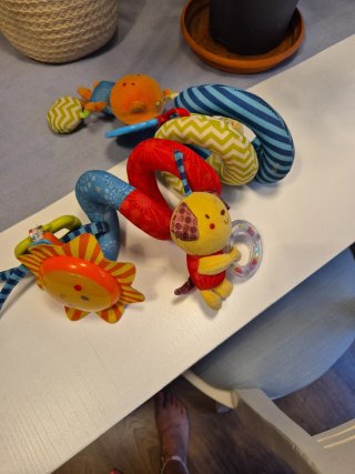 Juguete musical para carrito de bebé