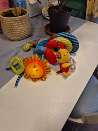 Juguete musical para carrito de bebé