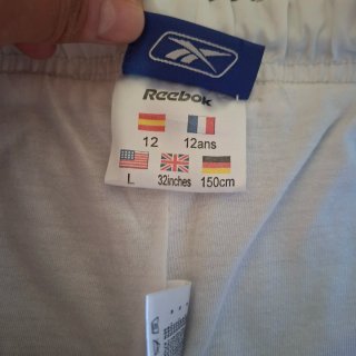 Pantalón deportivo niño Reebok gris y naranja