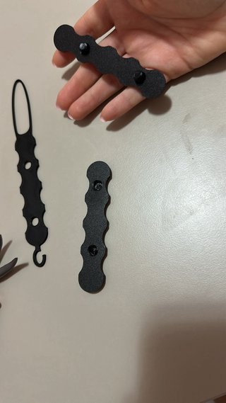 Ayuda para abrochar botones y subir cremalleras