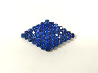 Bolso de fiesta + broche azul con piedras