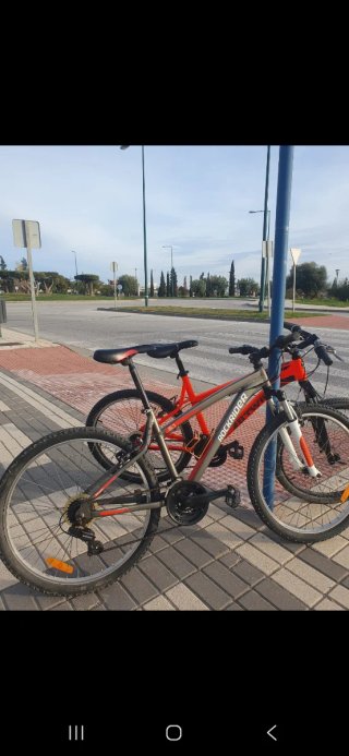 Bicicleta B'TWIN Naranja Montaña y bici rockrider