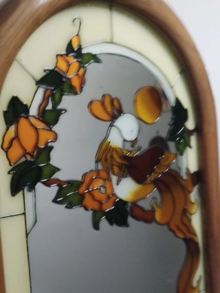 Specchio con decorazione floreale in bassorilievo