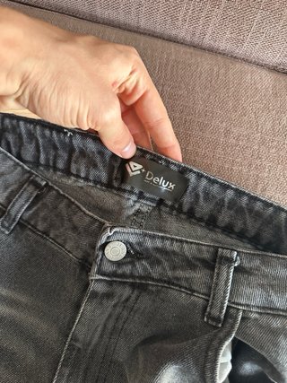 Jeans grigi con zip