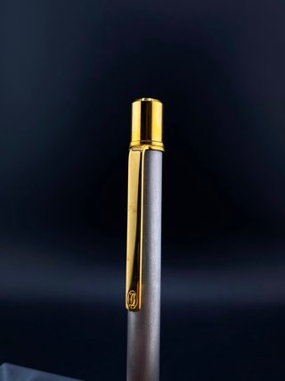 Bolígrafo Cartier Santos Acero Cepillado/Oro
