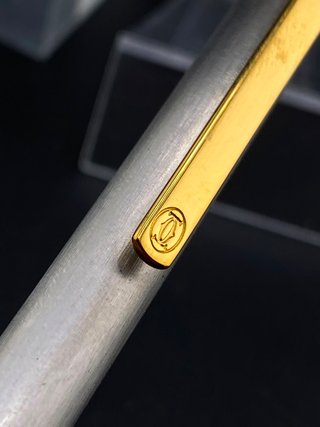 Bolígrafo Cartier Santos Acero Cepillado/Oro