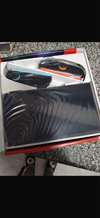 Nintendo Switch Naranja y Azul Con poco uso