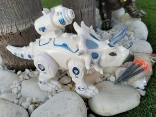Dinosaurio con luz y sonido que anda