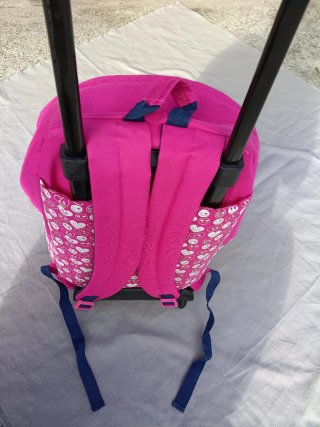 Mochila con ruedas y estampado de sonrisas rosa