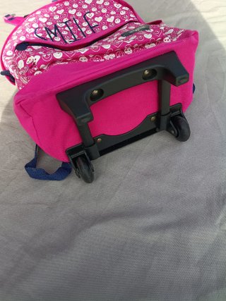 Mochila con ruedas y estampado de sonrisas rosa