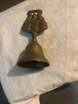Campanella in ottone con figure