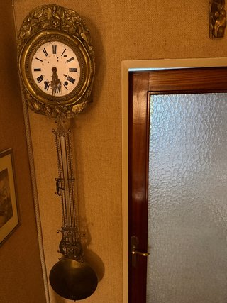 Reloj de péndulo antiguo dorado