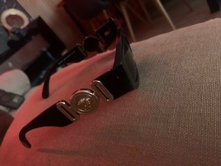 Gafas de sol Versace negras y doradas