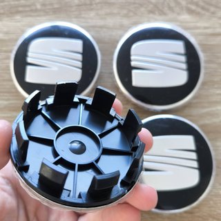 TAPABUJES SEAT 63mm NEGROS CON EMBLEMA PLATA