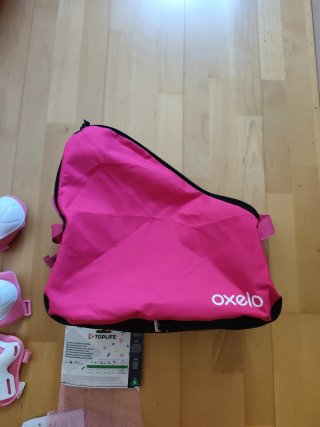 Bolsa y protecciones patines Oxelo rosa