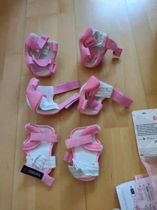 Bolsa y protecciones patines Oxelo rosa