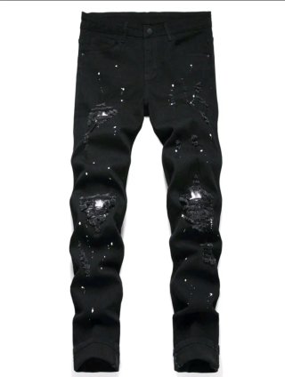 Pantalones negros rotos con salpicaduras
