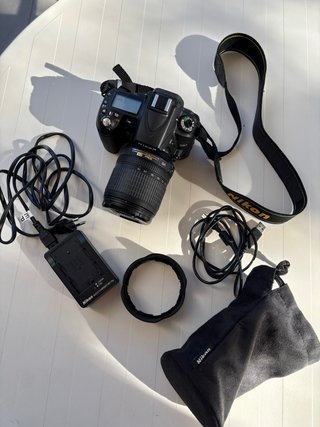 Nikon D90+Lente 18-105mm VR/1.986 disparos+mochila