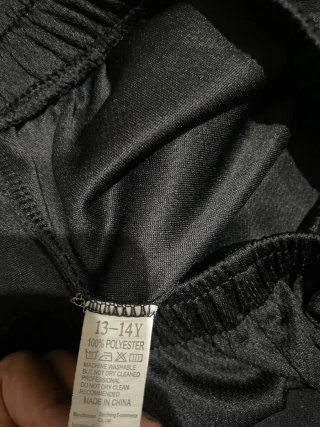 Pantaloncino nero con orso taglia 14 anni
