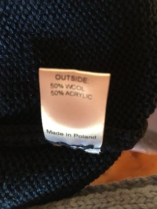 Berretto neonato in misto lana blu con pompon