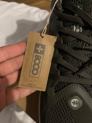 Zapatillas de correr verdes y blancas